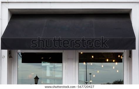 black awning  cafe windows stock photo edit