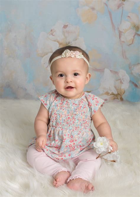 madelyn studio session   month  baby girl  big happy photo
