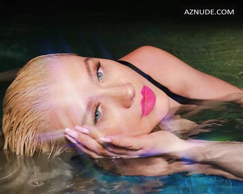 christina aguilera displays her tits while swimming in one piece in the