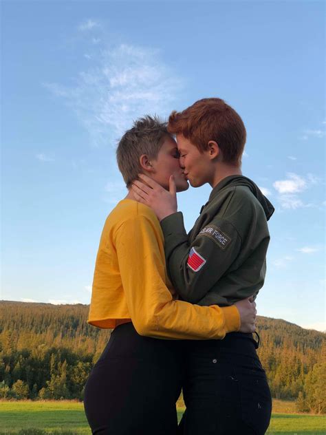 lesbian couple kissing in norway one redhead and a blonde short hair