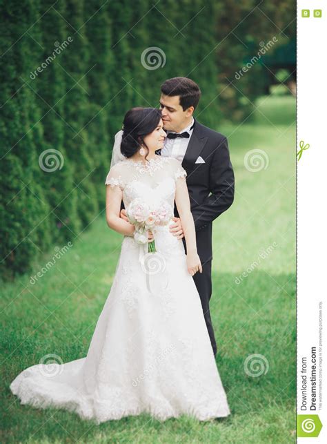 romantic fairytale happy newlywed couple hugging and