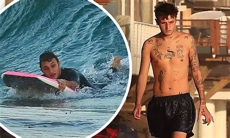 anwar hadid shows off his tattoos as he enjoys a solo beach day and