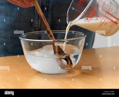 mixing milk  water   bowl stock photo alamy