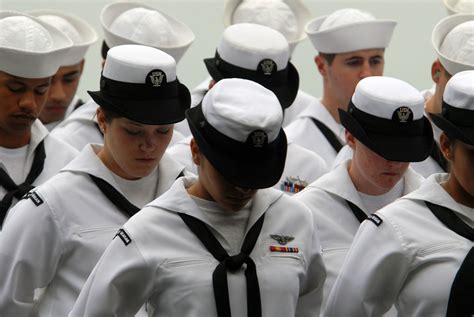 female navy recruits   wear dixie cup hats  move