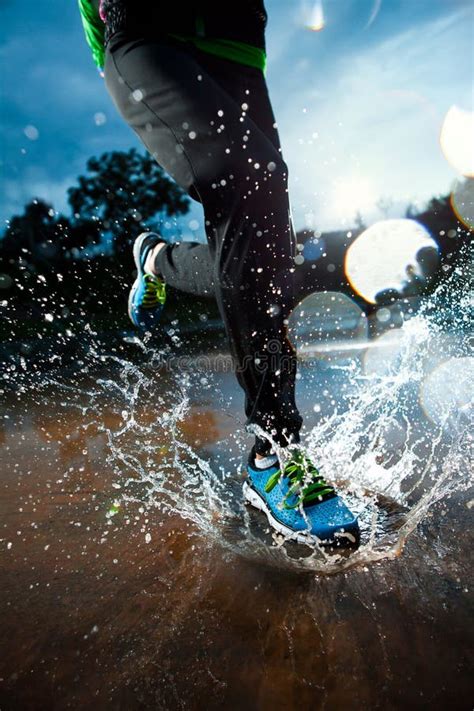 single runner running  rain stock image image