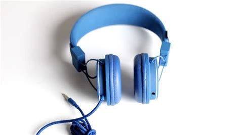 cool  blue audio headphones spinning stock footage video  royalty