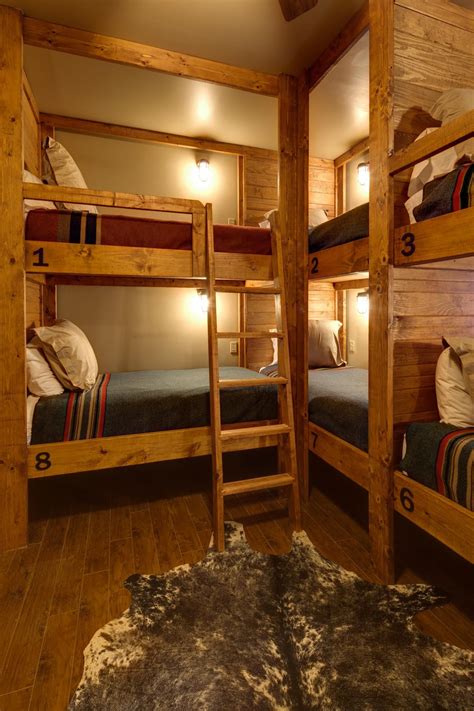 rustic lodge style bunk room boasts  slew  built  bunk beds maximizing space