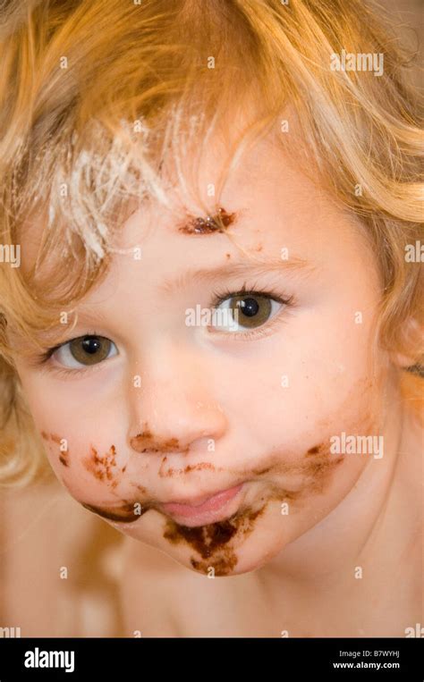 Young Girl 2 3 With Chocolate Covered Face After Making A Cake
