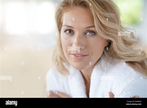 Portrait Of Beautiful 40 Year Old Woman Relaxing In Bathrobe At Home