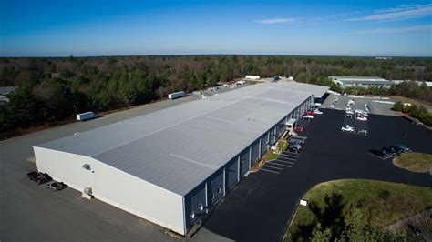 aerial view   warehouse building  cars parked   parking