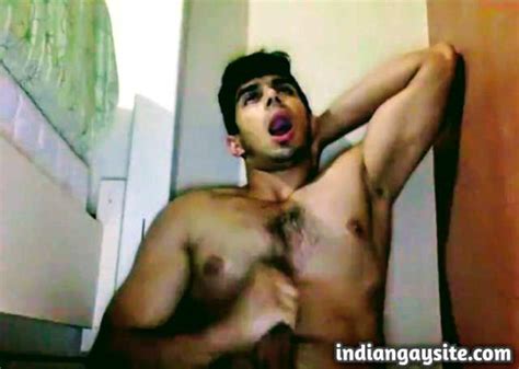 indian gay video of a sexy and horny desi hunk masturbating cumming in a spoon and eating it