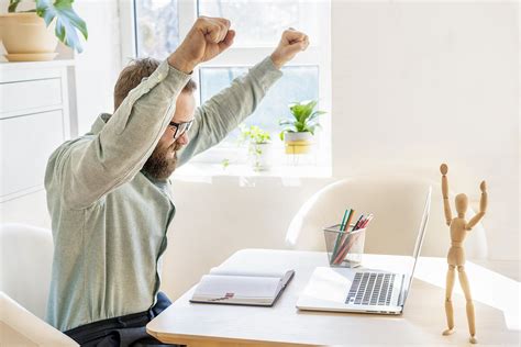 work  home happy businessman feel excitement raising fists