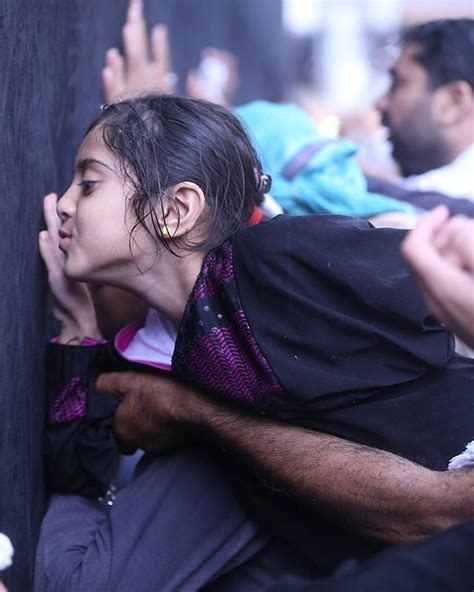 muslim girl trying to kiss the k`a bah photograph