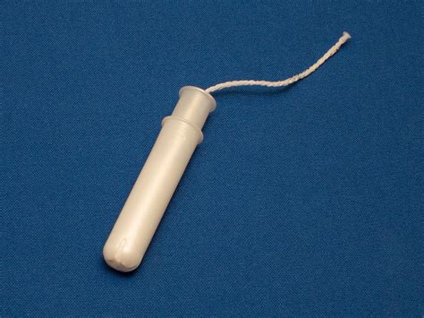 a tampon with plastic applicator earth buddies
