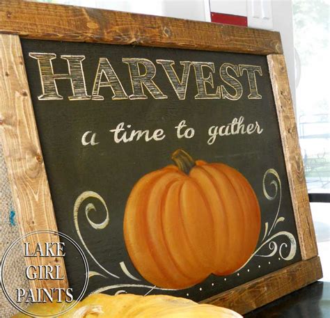 lake girl paints harvest pumpkin  pallet frame