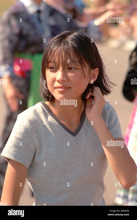 Attractive Asian Girl Age 15 Looking Curious At Asian American Festival