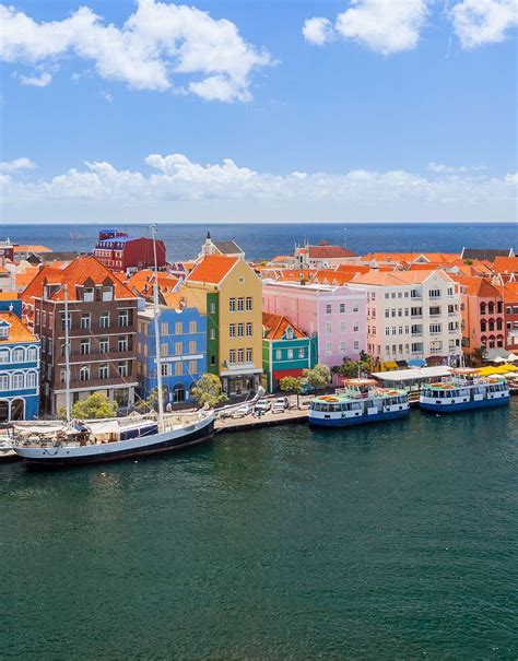 colorful buildings  willemstad curacao vacation places vacation destinations vacation spots