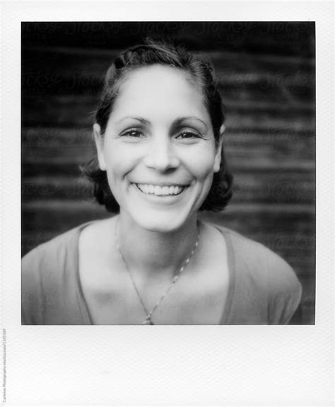 black and white instant photo of 38 year old woman by stocksy