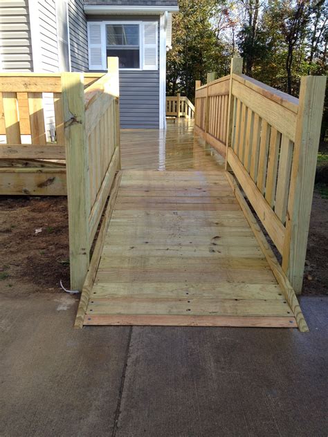 custom treated lumber handicap ramp  railings   deck wheelchair ramp porch