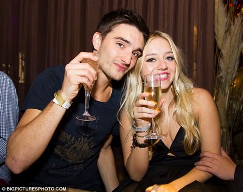tom parker s girlfriend shows off her party trick by shoving a champagne glass in her mouth at