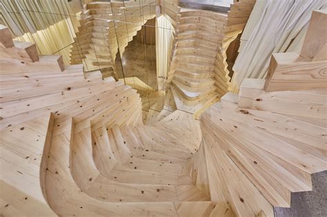 acmes wildly twisting wooden staircase draws inspiration  coco