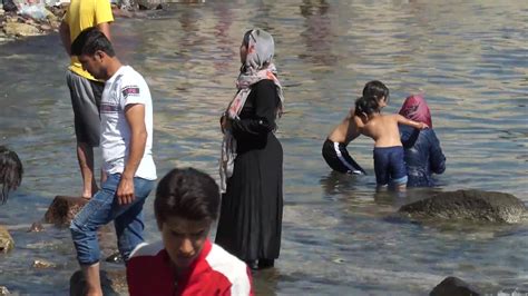 Greece Migrants Bathe And Wash Clothes In Sea Near Kara Tepe Refugee