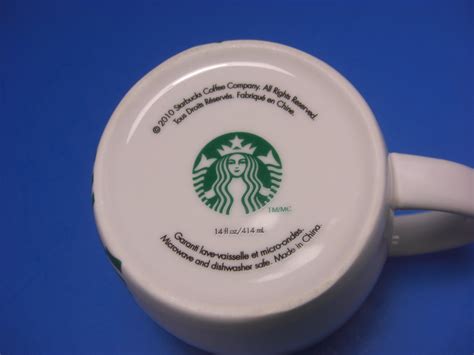 starbucks coffee mug 2010 mermaid logo green and white
