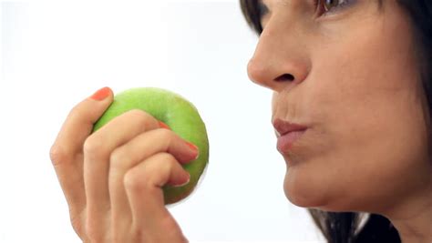 female mouth eating apple close up stock footage video