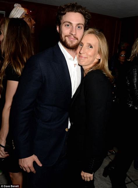 aaron taylor johnson and wife sam taylor wood cuddle up at fundraiser