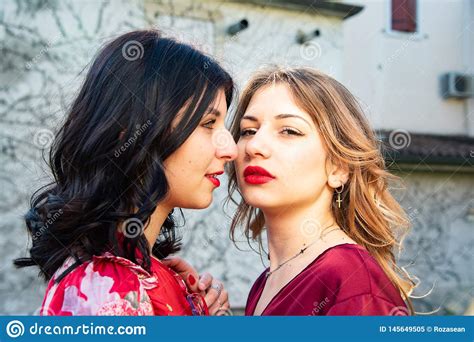 Close Up Of Two Lesbian Friends One Blonde And The Other Brunette Are