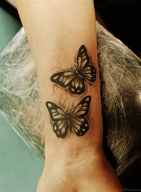 divine butterfly wrist tattoos design
