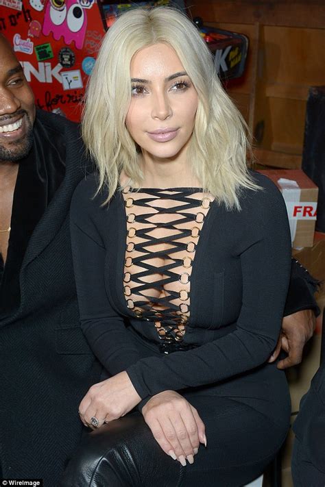 braless kim kardashian displays her cleavage in deeply plunging catsuit