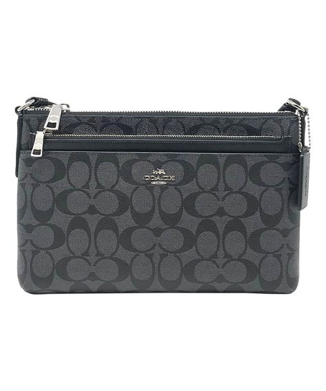 take a look at this black signature crossbody bag and pouch today