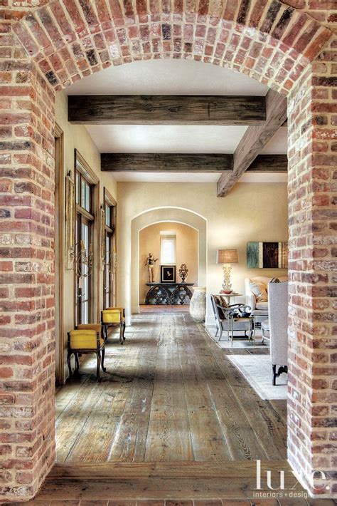 traditional neutral hallway  arched brick entry