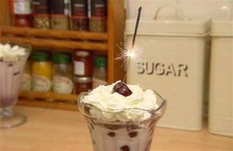 black cherries in brandy with ice cream and squirty cream