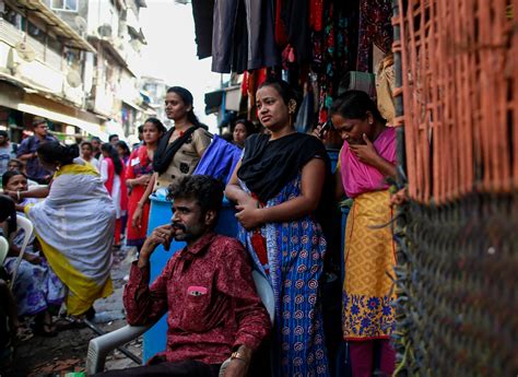 female sex workers fsws watch a street performance to mark world aids day in kamathipura