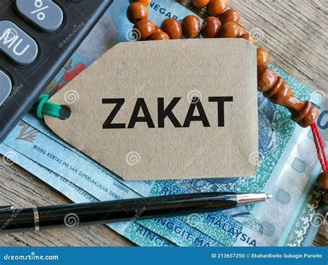 phrase zakat written  label tag  moneyprayer beads  calculator stock photo image