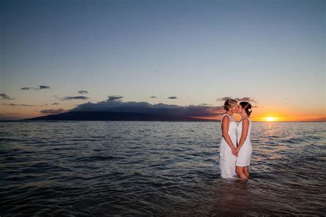 Romantic Lesbian Kiss At Wedding In Ocean Water At Sunset