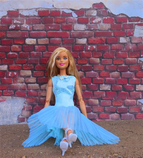 Blonde Barbie Doll At Brick Wall Free Image Download