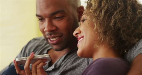black couple talking on smartphone stock footage video