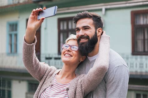 Happy Couple Taking Selfie Outdoor By Stocksy Contributor Mak Stocksy