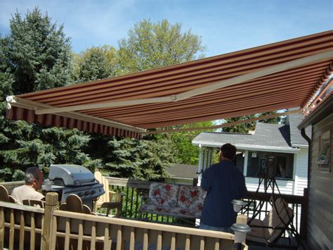 awnings retractable  fixed sunshades traditional patio   loebrich contracting