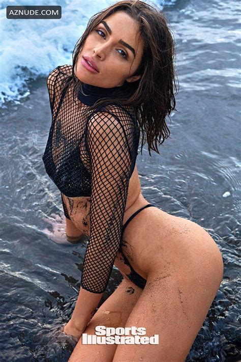 olivia culpo poses on the beach for a new issue of sports