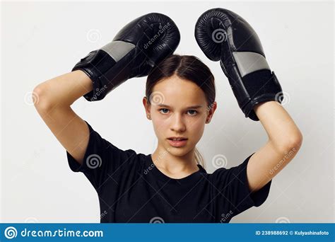 beautiful girl in black sports uniform boxing gloves posing lifestyle