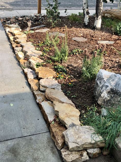 garden edging idea  stacked stone works perfectly   gentle
