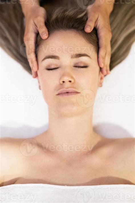 Young Blond Woman Receiving A Head Massage In A Spa Center 4675033