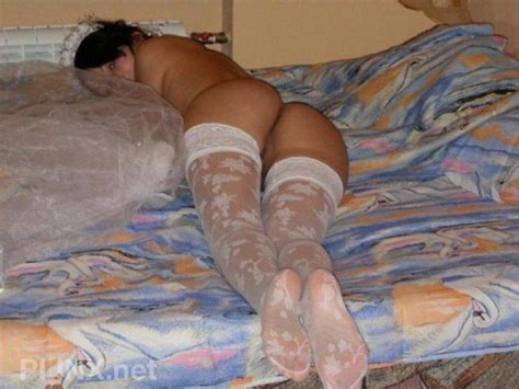 demure in white stockings exposed nethers ready to be used on her wedding night bride sluts