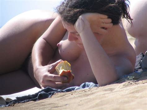 Wis Naked On Beach With Puffy Nipples Reading A Book