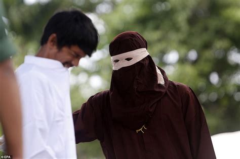 woman is caned in public for having sex outside wedlock in