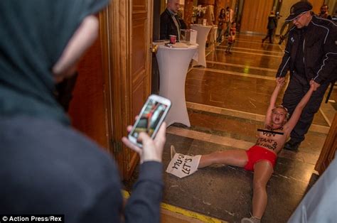 topless femen protesters draggedout of berlin s islamic week meeting daily mail online